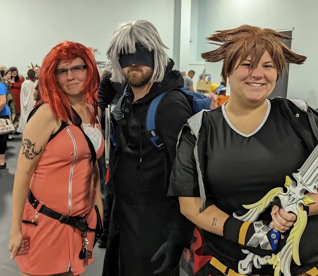 Fans posing together at a Charlie’s Comic Con event