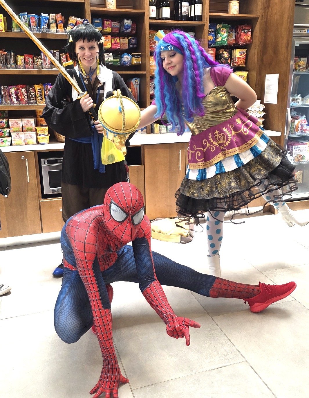 Spider-Man and fellow cosplayers at a Charlie’s event