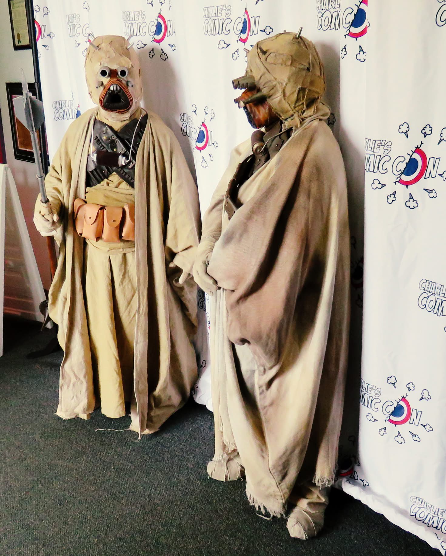 Two costumed fans posing at a past Charlie’s event