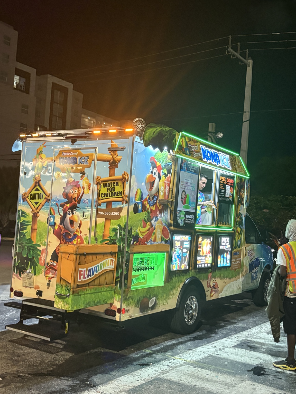 The illuminated Kona Ice truck outside JAM Arena