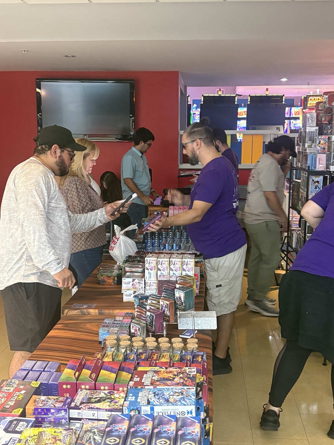 Collectors browsing trading cards at JAM Arena